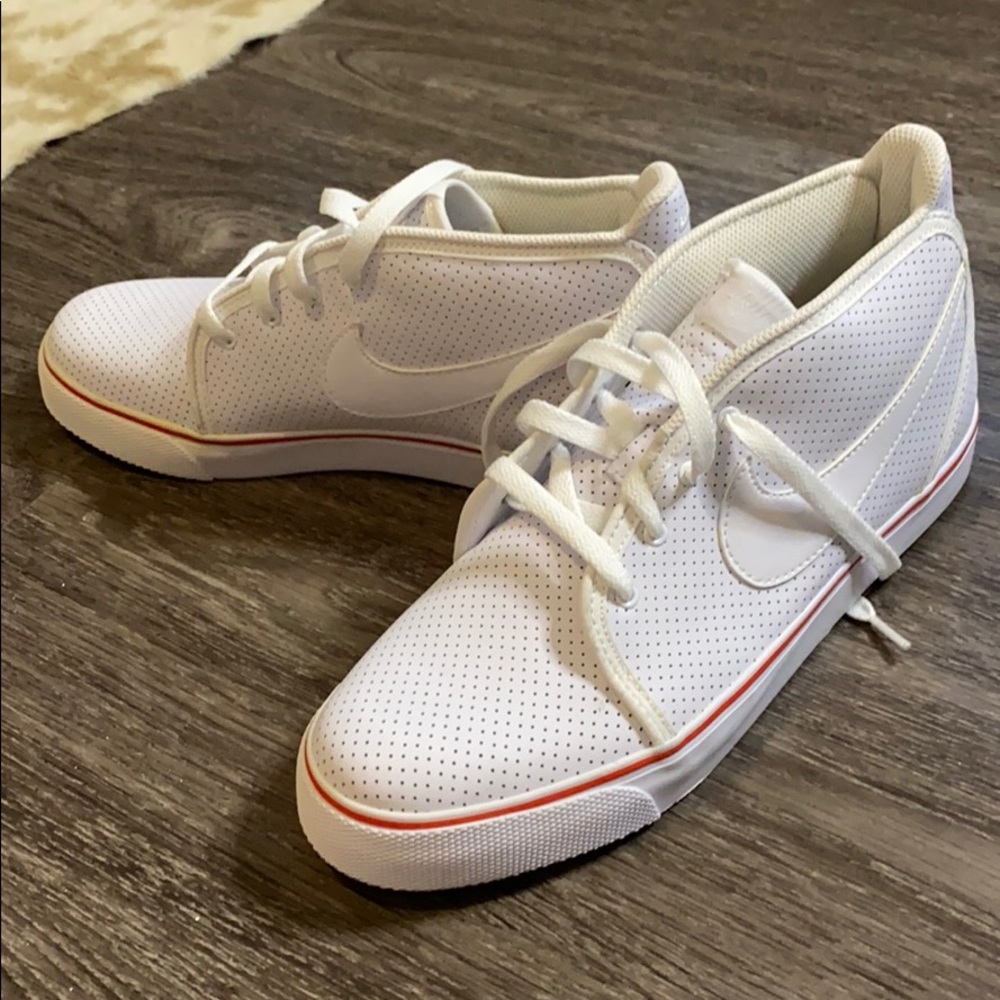 All white Nike High tops